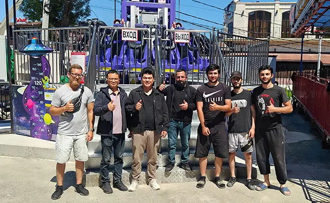 A Photo of Beston Engineer and Client Installation Team in Front of the Drop Tower in Russia