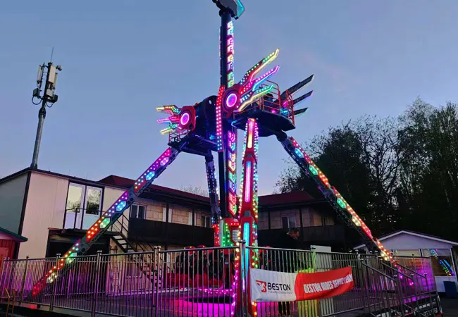 The Pendulum Ride Glowing with Vibrant, Colorful LED Lights during Final Technical Testing and Calibration.