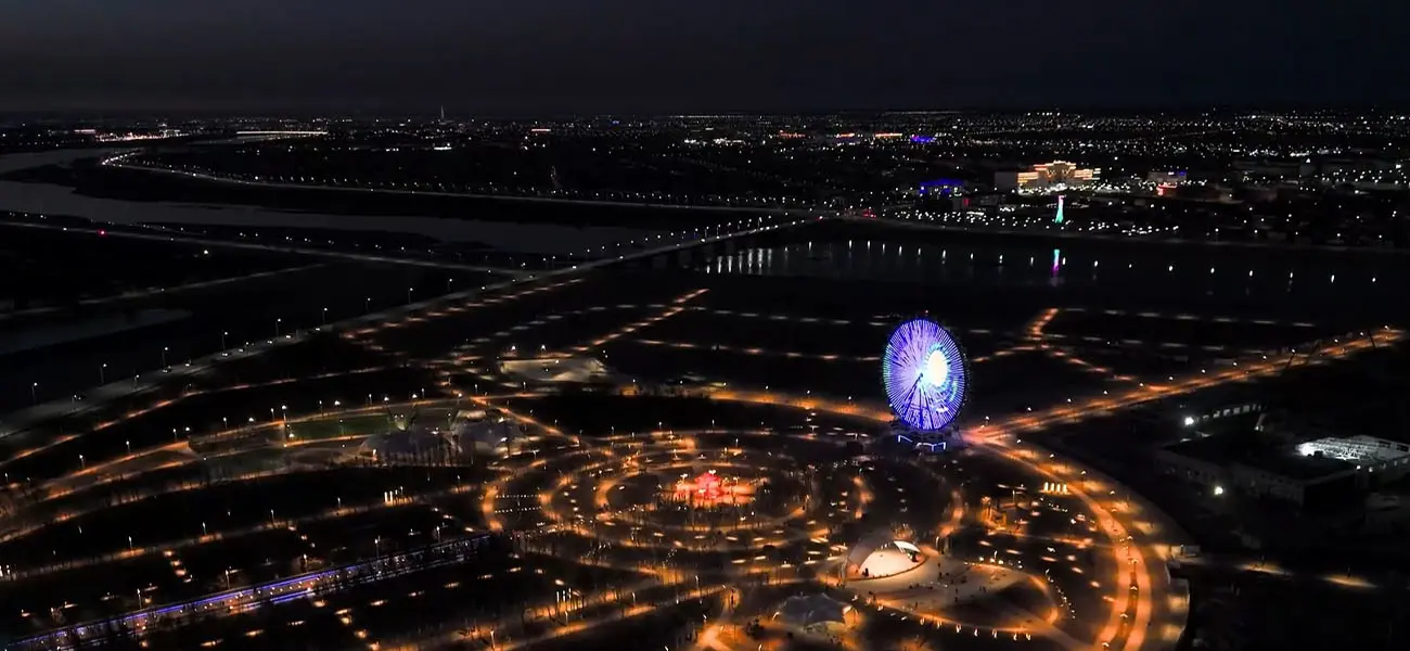 Aerial Night View of Beston 50m Ferris Wheel in Kyzylorda's Presidential Park, Kazakhstan.
