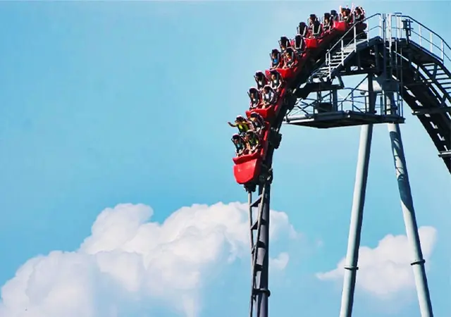 Roller Coaster Going Over a Hill Crest and Delivering a Weightless Sensation